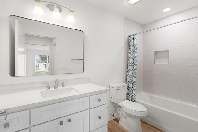 1313 Arredondo Dr, The Villages, FL 32162 - bathroom featuring vanity, wood finished floors, toilet, and shower / tub combo