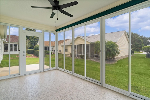 1313 Arredondo Dr, The Villages, FL 32162 - unfurnished sunroom with a ceiling fan and plenty of natural light