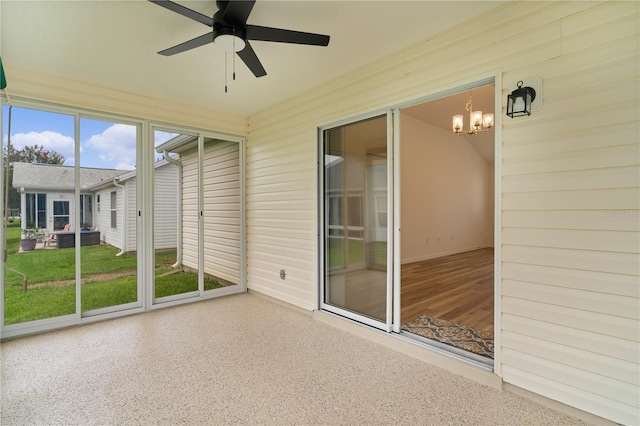 1313 Arredondo Dr, The Villages, FL 32162 - unfurnished sunroom featuring ceiling fan and a chandelier