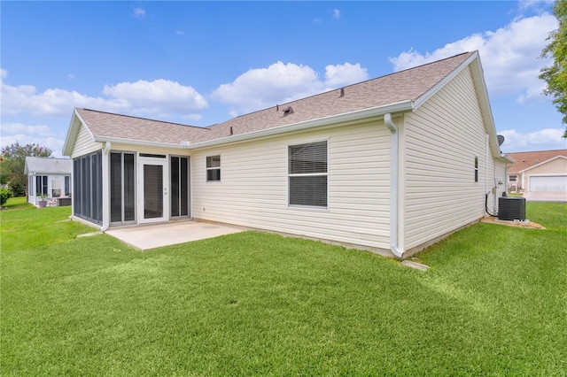 1313 Arredondo Dr, The Villages, FL 32162 - rear view of property with a patio, a lawn, and a shingled roof