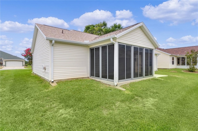 1313 Arredondo Dr, The Villages, FL 32162 - back of house featuring a sunroom, a lawn, and a shingled roof