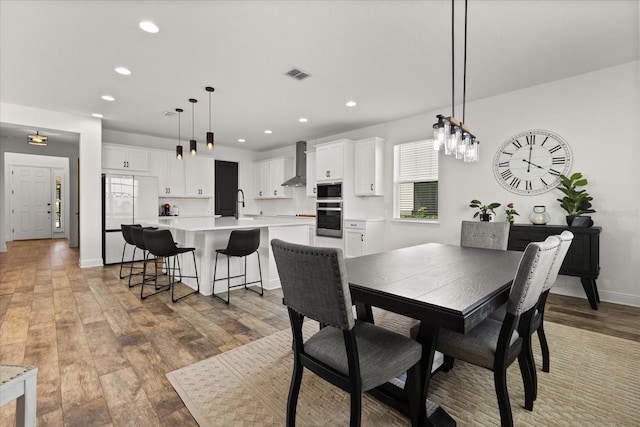 17700 Sawgrass Run, Tavares, FL 32778 - dining space with recessed lighting and light wood-type flooring