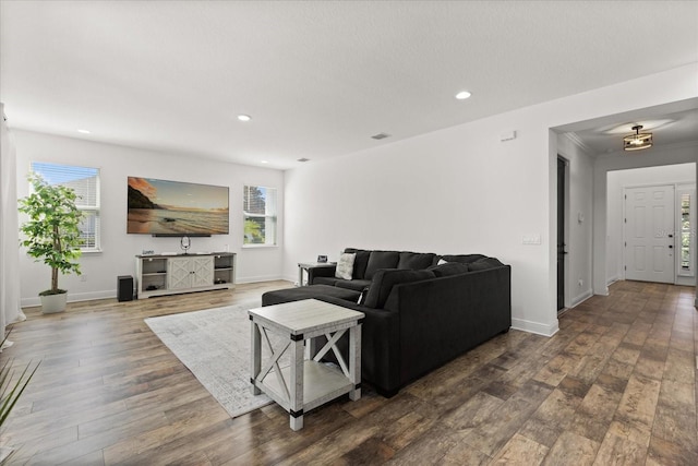17700 Sawgrass Run, Tavares, FL 32778 - living room featuring healthy amount of natural light, wood finished floors, and recessed lighting