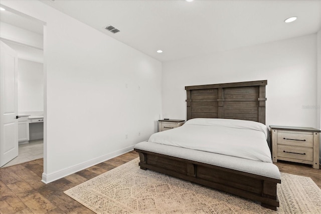 17700 Sawgrass Run, Tavares, FL 32778 - bedroom featuring wood finished floors and recessed lighting