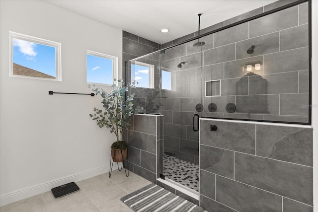 17700 Sawgrass Run, Tavares, FL 32778 - bathroom featuring a stall shower, tile patterned flooring, and recessed lighting