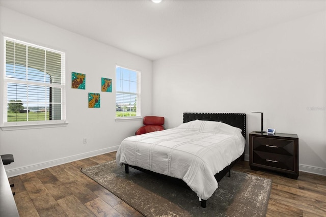 17700 Sawgrass Run, Tavares, FL 32778 - bedroom featuring baseboards and wood finished floors
