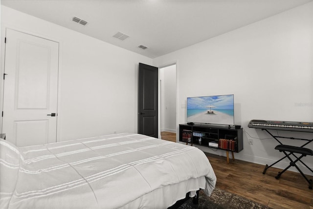 17700 Sawgrass Run, Tavares, FL 32778 - bedroom featuring baseboards and wood finished floors