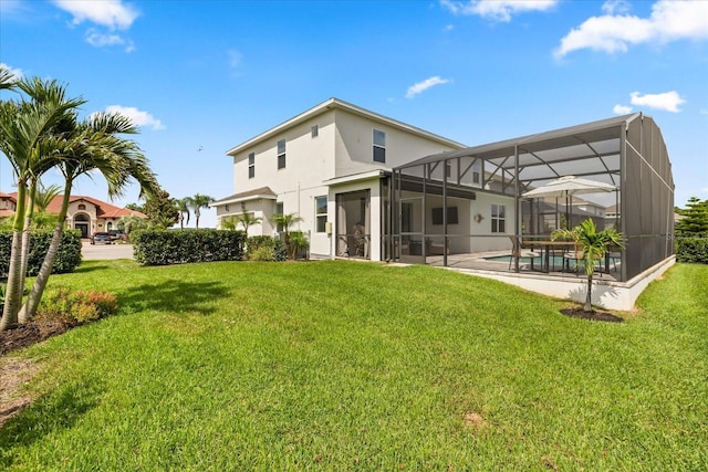 17700 Sawgrass Run, Tavares, FL 32778 - back of property with a yard, an outdoor pool, glass enclosure, and stucco siding