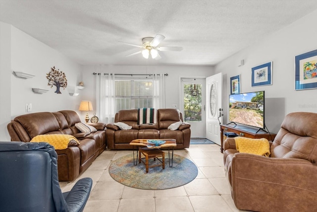 2542 N Regatta Pt, Crystal River, FL 34429 - living area featuring ceiling fan, light tile patterned flooring, and a textured ceiling