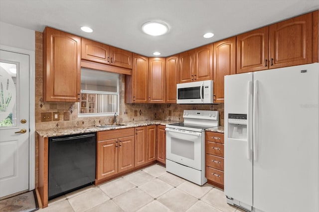 2542 N Regatta Pt, Crystal River, FL 34429 - kitchen featuring white appliances, a sink, light stone countertops, backsplash, and recessed lighting