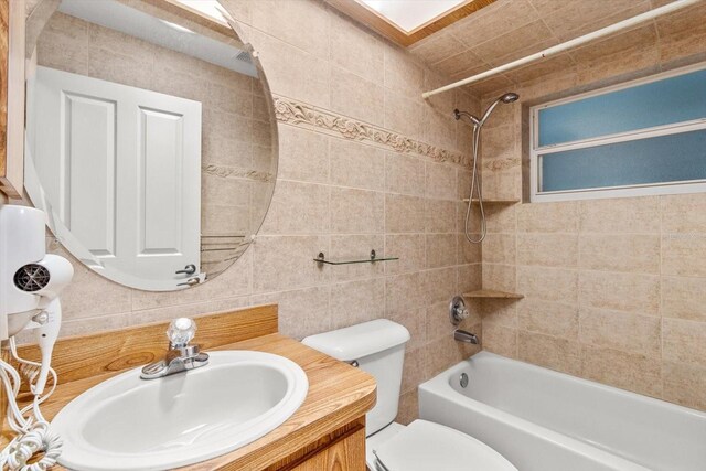 2542 N Regatta Pt, Crystal River, FL 34429 - full bathroom with shower / bath combination, tile walls, toilet, and vanity