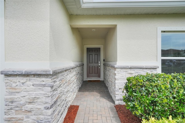 641 Black Eagle Dr, Groveland, FL 34736 - property entrance featuring stucco siding and stone siding