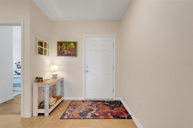 641 Black Eagle Dr, Groveland, FL 34736 - foyer entrance featuring baseboards and light tile patterned flooring