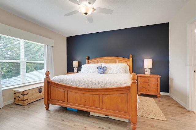 641 Black Eagle Dr, Groveland, FL 34736 - bedroom with light wood-type flooring, baseboards, and ceiling fan