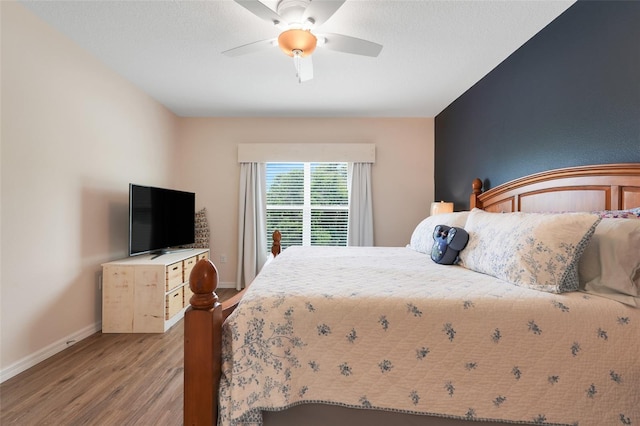 641 Black Eagle Dr, Groveland, FL 34736 - bedroom with light wood-type flooring, baseboards, and ceiling fan