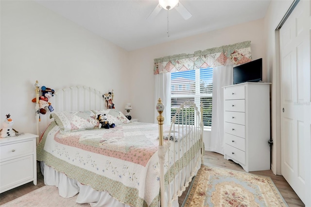 641 Black Eagle Dr, Groveland, FL 34736 - bedroom with light wood finished floors and a ceiling fan