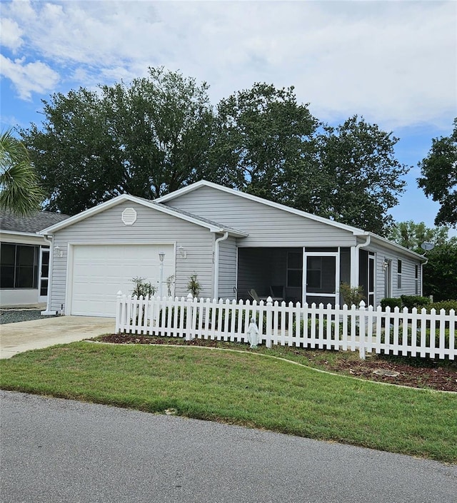 2105 Escobar Ave, The Villages, FL 32159 - ranch-style house featuring a garage and driveway