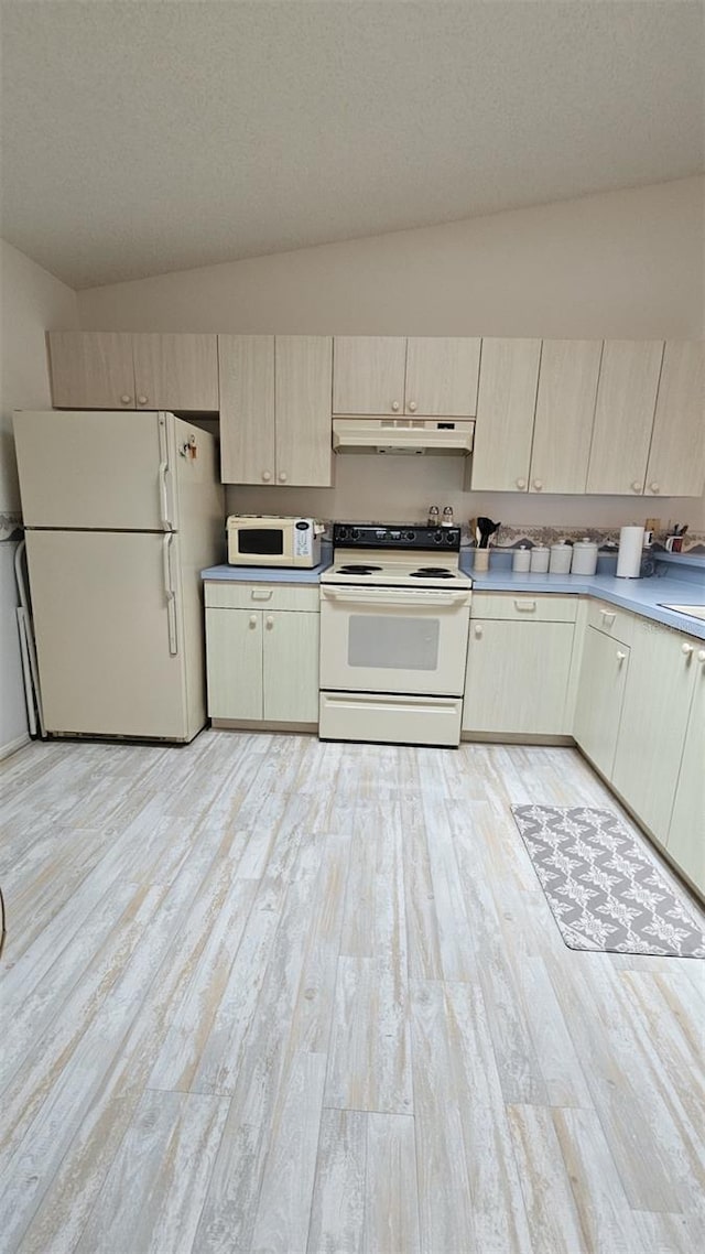 2105 Escobar Ave, The Villages, FL 32159 - kitchen featuring white appliances, under cabinet range hood, light wood finished floors, light countertops, and light brown cabinetry