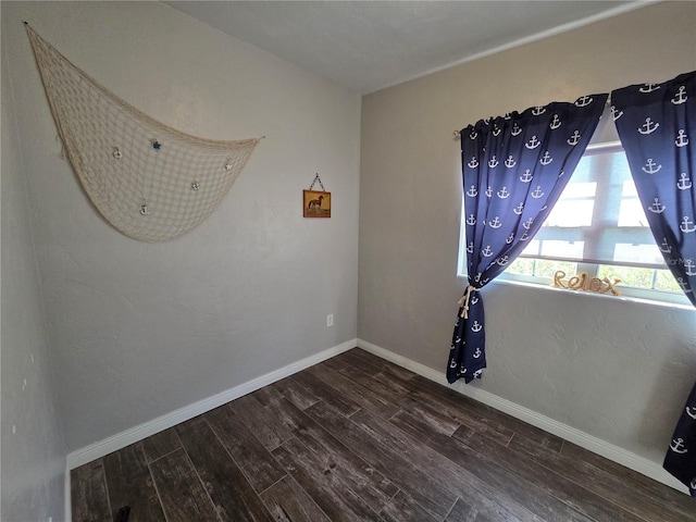 504 SE 35th Ave, Ocala, FL 34471 - empty room with dark wood-style flooring and baseboards
