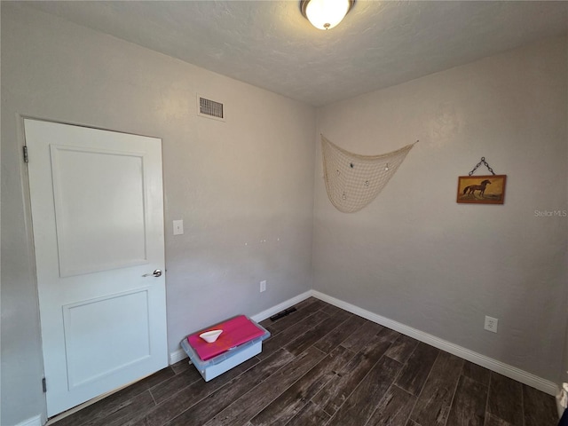 504 SE 35th Ave, Ocala, FL 34471 - empty room featuring dark wood finished floors and baseboards