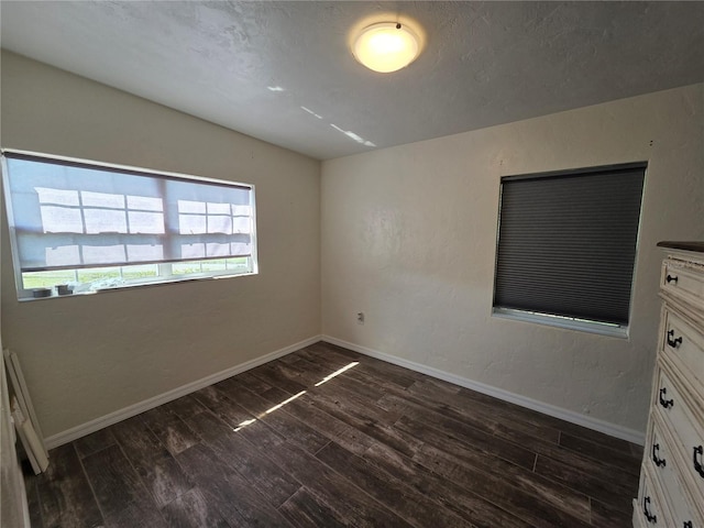 504 SE 35th Ave, Ocala, FL 34471 - unfurnished bedroom with dark wood-style floors and baseboards