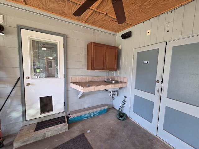 504 SE 35th Ave, Ocala, FL 34471 - view of exterior entry with a ceiling fan, french doors, and a sink