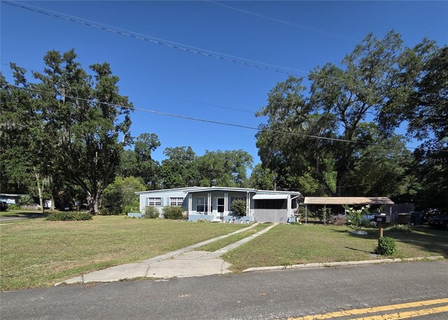 504 SE 35th Ave, Ocala, FL 34471 - view of front of home with a front lawn and a carport