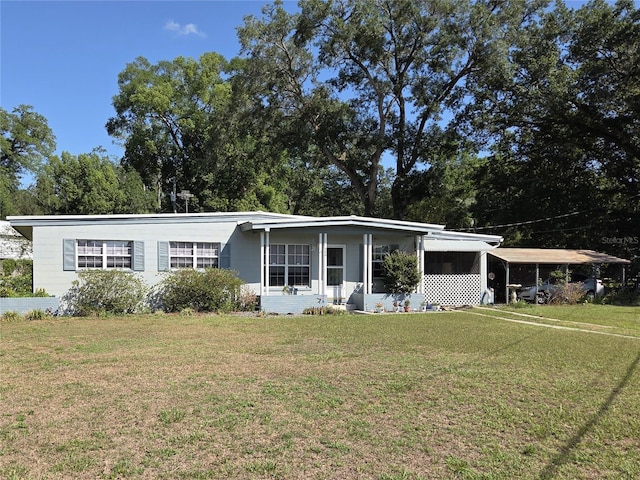 504 SE 35th Ave, Ocala, FL 34471 - view of front of property featuring a front yard and an attached carport