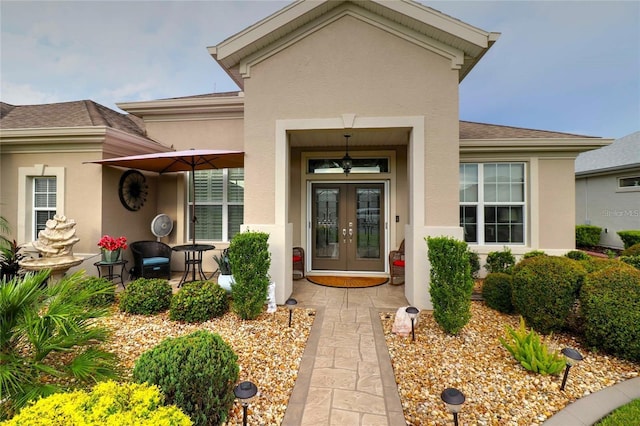 11868 SE 91st Cir, Summerfield, FL 34491 - entrance to property featuring stucco siding, french doors, and roof with shingles