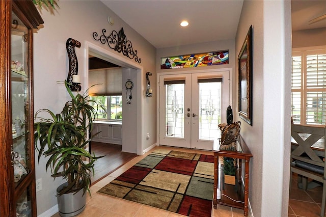 11868 SE 91st Cir, Summerfield, FL 34491 - entryway featuring french doors, tile patterned flooring, recessed lighting, and baseboards