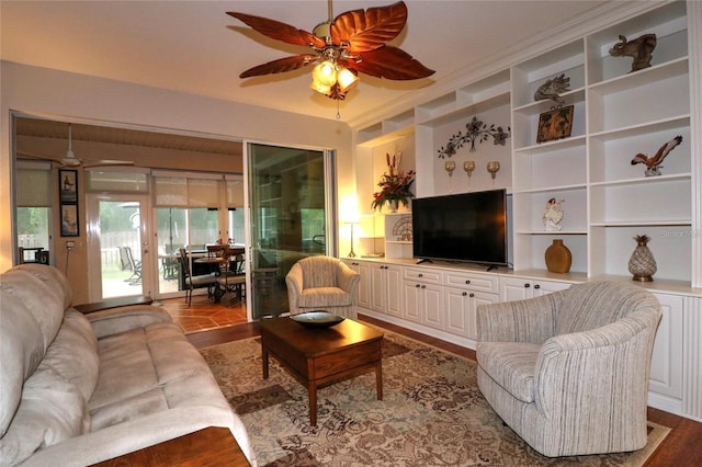 11868 SE 91st Cir, Summerfield, FL 34491 - living room featuring a ceiling fan, built in shelves, and wood finished floors