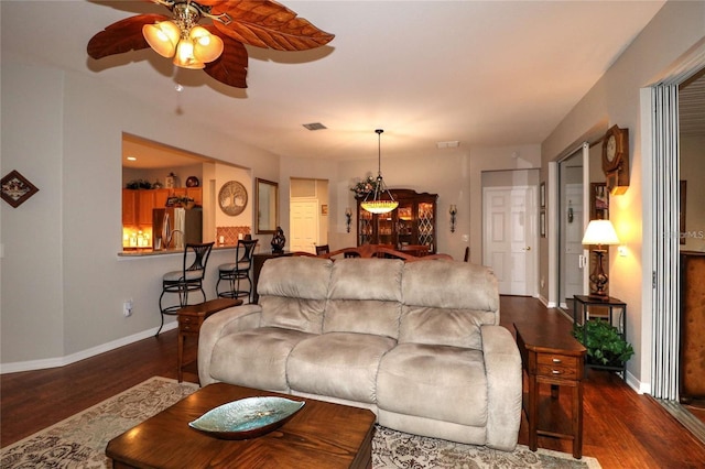 11868 SE 91st Cir, Summerfield, FL 34491 - living area with ceiling fan, wood finished floors, and baseboards