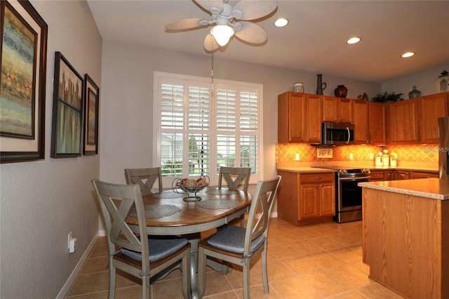 11868 SE 91st Cir, Summerfield, FL 34491 - dining room with recessed lighting, ceiling fan, light tile patterned floors, and baseboards