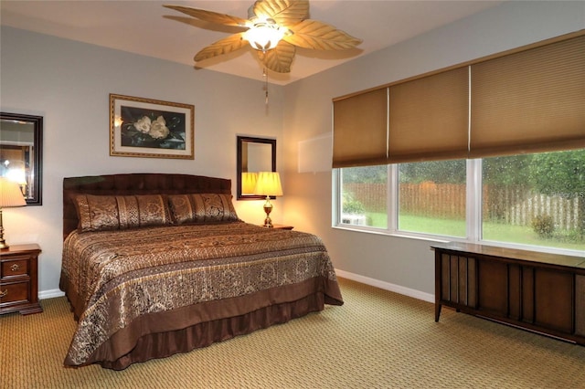 11868 SE 91st Cir, Summerfield, FL 34491 - bedroom with carpet, baseboards, and a ceiling fan