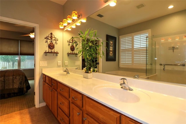 11868 SE 91st Cir, Summerfield, FL 34491 - full bathroom with double vanity, tile patterned floors, a stall shower, ensuite bath, and ceiling fan