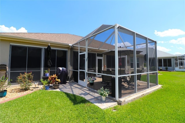 11868 SE 91st Cir, Summerfield, FL 34491 - rear view of property with a yard, a shingled roof, a patio area, and a lanai