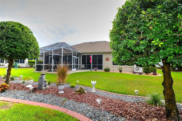 11868 SE 91st Cir, Summerfield, FL 34491 - rear view of property with a lawn, a lanai, and stucco siding