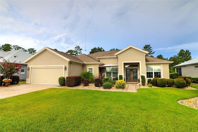 11868 SE 91st Cir, Summerfield, FL 34491 - view of front of house featuring french doors, stucco siding, a garage, a front lawn, and driveway