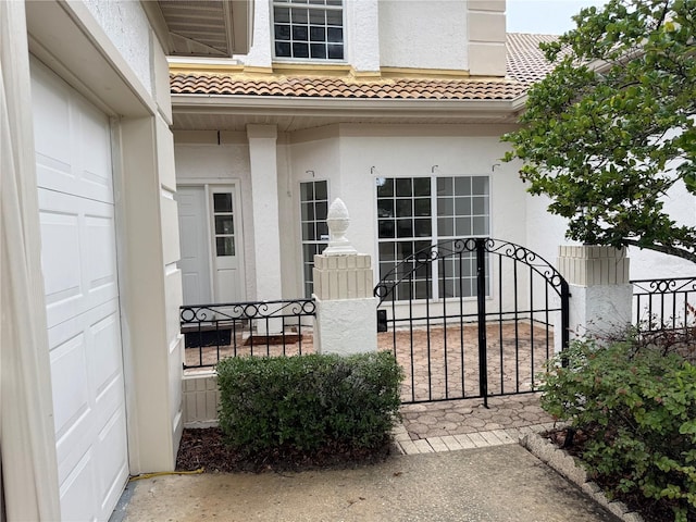 2450 Sweetwater Country Club Dr, Apopka, FL 32712 - entrance to property featuring stucco siding and a tiled roof