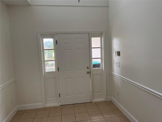 2450 Sweetwater Country Club Dr, Apopka, FL 32712 - foyer with light tile patterned floors and baseboards