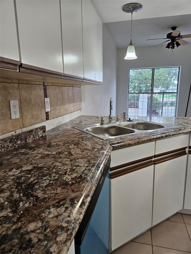 2450 Sweetwater Country Club Dr, Apopka, FL 32712 - kitchen with white cabinets, a sink, dishwasher, and tasteful backsplash