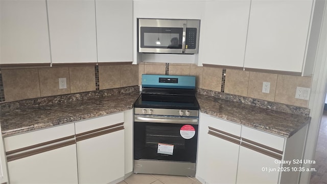 2450 Sweetwater Country Club Dr, Apopka, FL 32712 - kitchen with appliances with stainless steel finishes, white cabinets, and backsplash