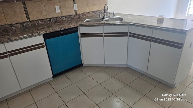 2450 Sweetwater Country Club Dr, Apopka, FL 32712 - kitchen with dishwasher, a sink, white cabinetry, and light tile patterned flooring