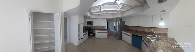 2450 Sweetwater Country Club Dr, Apopka, FL 32712 - kitchen with appliances with stainless steel finishes, a sink, decorative backsplash, dark countertops, and decorative light fixtures