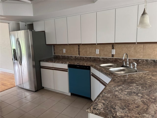 2450 Sweetwater Country Club Dr, Apopka, FL 32712 - kitchen featuring dishwashing machine, stainless steel fridge, a sink, and white cabinetry