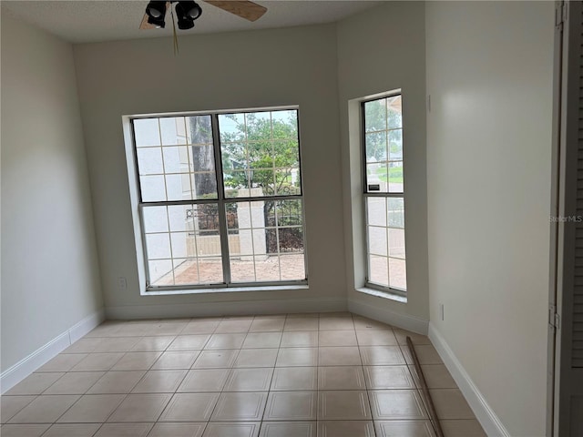 2450 Sweetwater Country Club Dr, Apopka, FL 32712 - unfurnished room featuring plenty of natural light, a ceiling fan, and baseboards