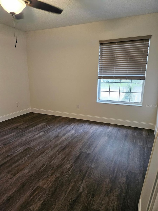 2450 Sweetwater Country Club Dr, Apopka, FL 32712 - unfurnished room featuring dark wood-style flooring, baseboards, and a ceiling fan