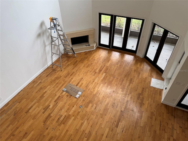 2450 Sweetwater Country Club Dr, Apopka, FL 32712 - unfurnished living room featuring light wood-style flooring and baseboards