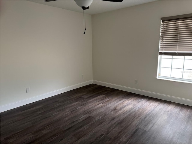 2450 Sweetwater Country Club Dr, Apopka, FL 32712 - spare room with a ceiling fan, baseboards, and dark wood-type flooring