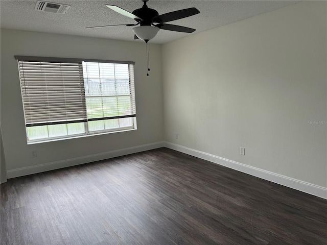 2450 Sweetwater Country Club Dr, Apopka, FL 32712 - unfurnished room with dark wood-style floors, ceiling fan, a textured ceiling, and baseboards